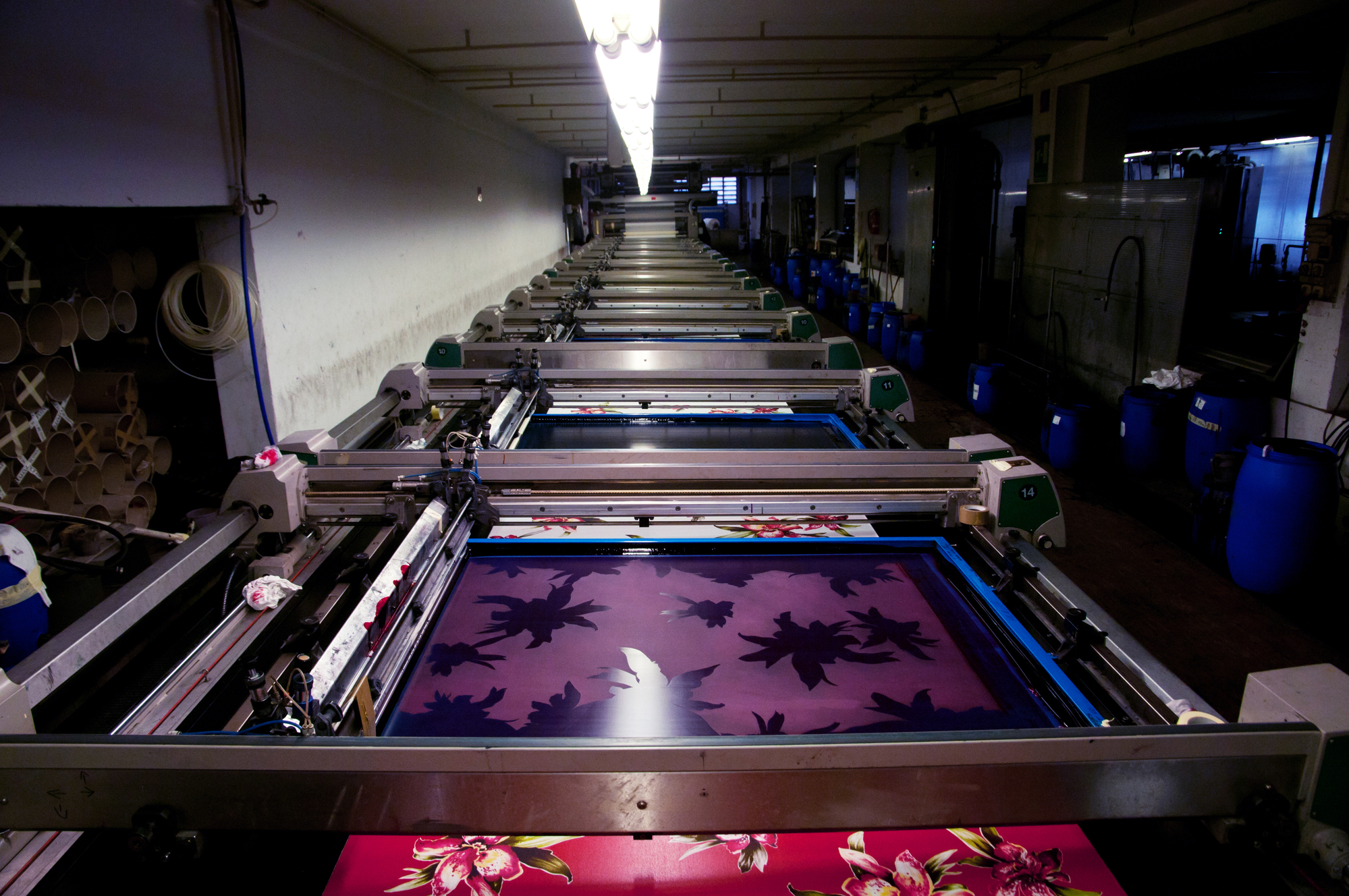 In-house experts at Euphoric Colors examining the quality of printed fabric"